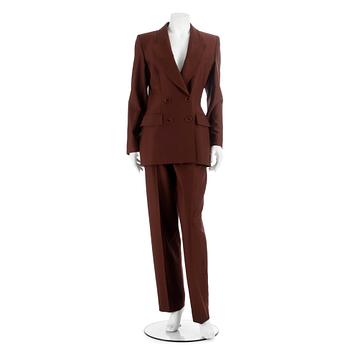 457. YVES SAINT LAURENT, a brown two-pieces wool suit consisting of jacket and pants. Size 40.