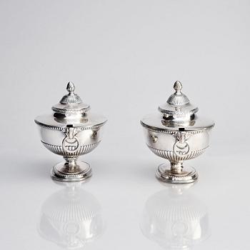 An English pair of sauce tureens with covers, mark of Andrew Fogelberg, London 1774.