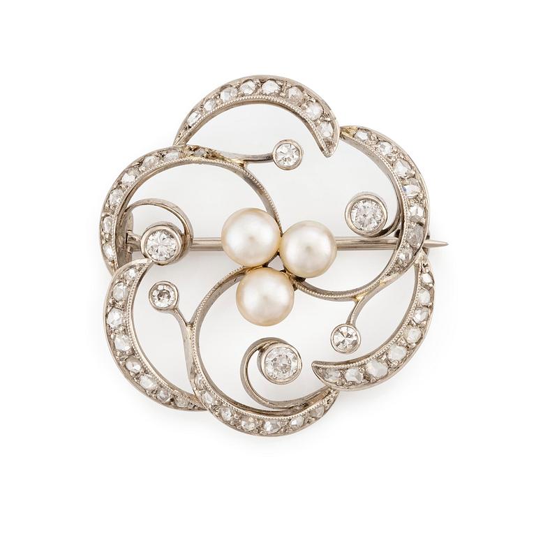 A W.A. Bolin brooch in 18K white gold set with round brilliant-, eight- and rose-cut diamonds and pearls.