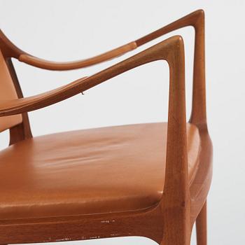 Hans Asplund, a walnut and leather easy chair, Nordiska Kompaniet, ca 1955, for the Nordiska Kompaniet beauty salon.