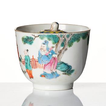 A famille rose 'trick cup' with a little figure, Qing dynasty, 19th Century.