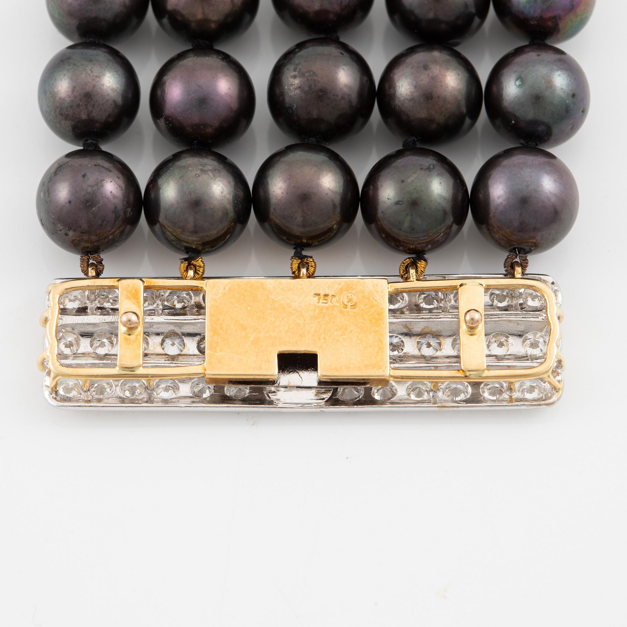 Necklace, five-row with cultured black pearls, 18K gold and white gold with brilliant-cut diamonds.