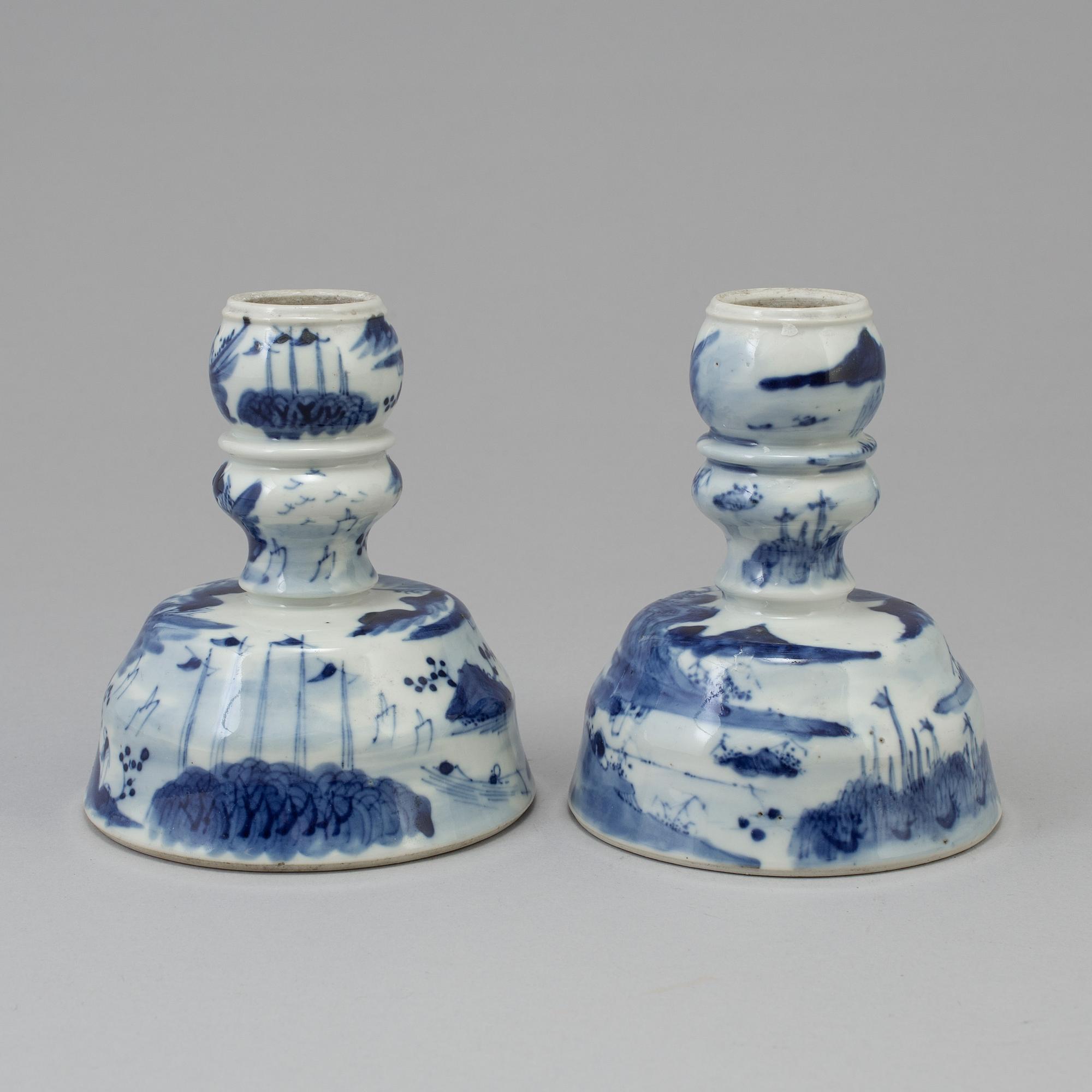 A pair of blue and white candlesticks, late Qingdynasty.