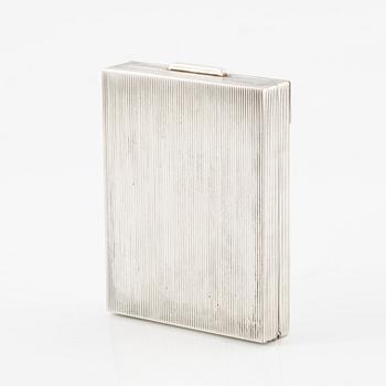 Powder box, signed Cartier, sterling silver and 14K gold with three sapphires.