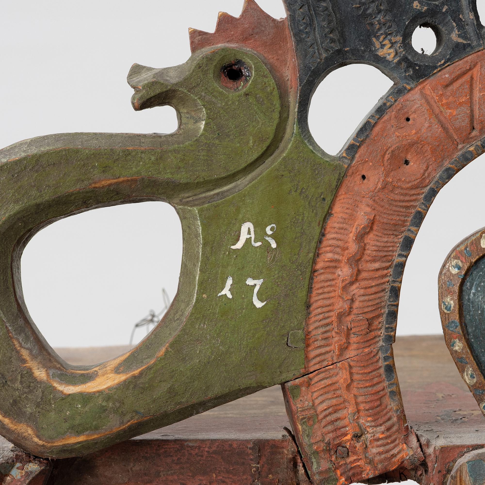A Swedish carved and painted folk art shelf from Hälsingland, 18th / 19th century.