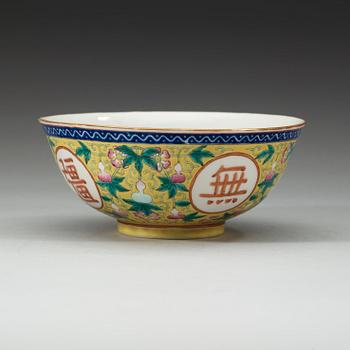 A famille rose yellow ground bowl, Qing dynasty, Guangxu six-character mark and of the period  (1875-1908).