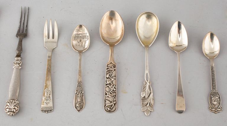 A collection of silver of 57 pcs, i.a souvenir spoons, 20th century. Total weight 1073 g.