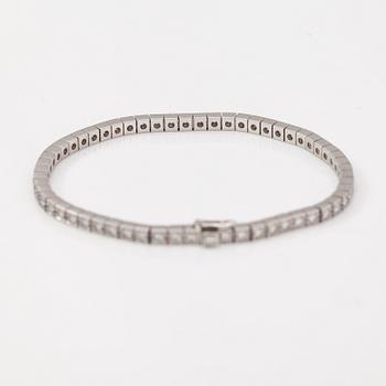 Cartier, Rannekoru "Lanieres", 18K valkokultaa, timantteja n. 1.77 ct yht. Merkitty Cartier, OY8558, 16.