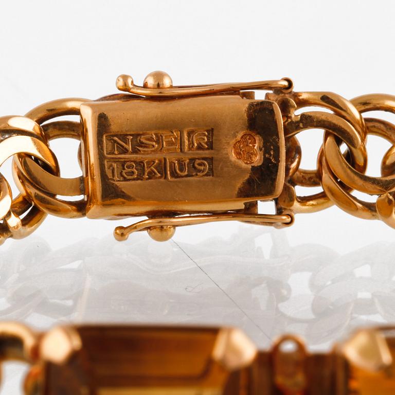 ARMBAND, 18K guld med fasettslipade citriner, NSE, Köping, 1970. Vikt 26,0 gram.