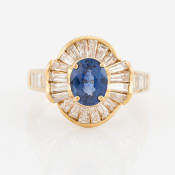 Ring, 18K gold with sapphire and baguette-cut diamonds.