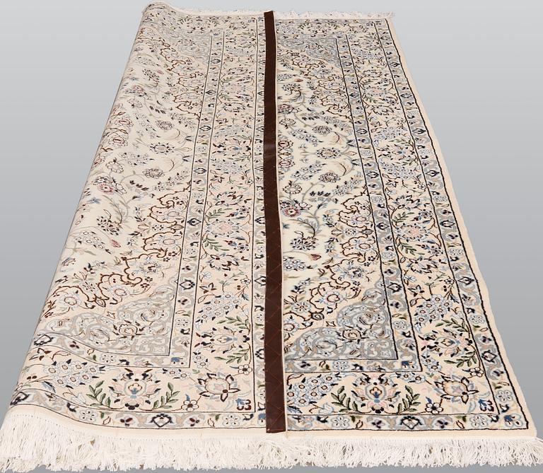 A Nain part silk carpet, 254 x 156 cm.