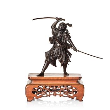 1166. A Japanese bronze sculpture of a samurai warrior, presumably Taisho, or later. Signed.