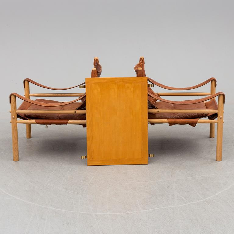 A pair of easy chairs by Arne Norell with a table leaf.