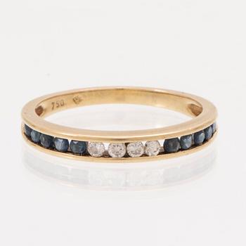 An 18K gold ring and a pair of earrings by H. Stern set with round brilliant cut diamonds and sapphires.