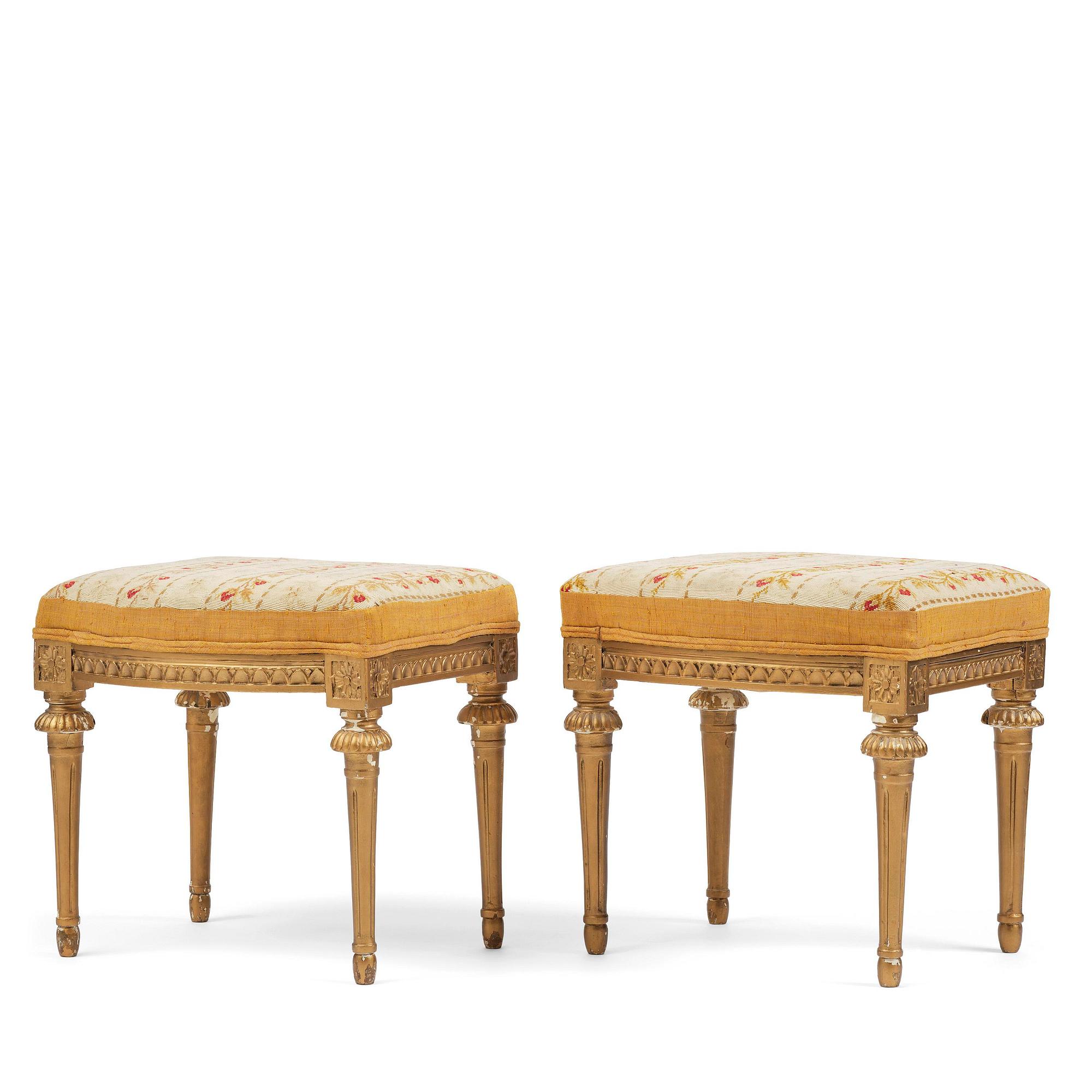 A pair of giltwood stools by E. Ståhl (master in Stockholm 1794-1820).