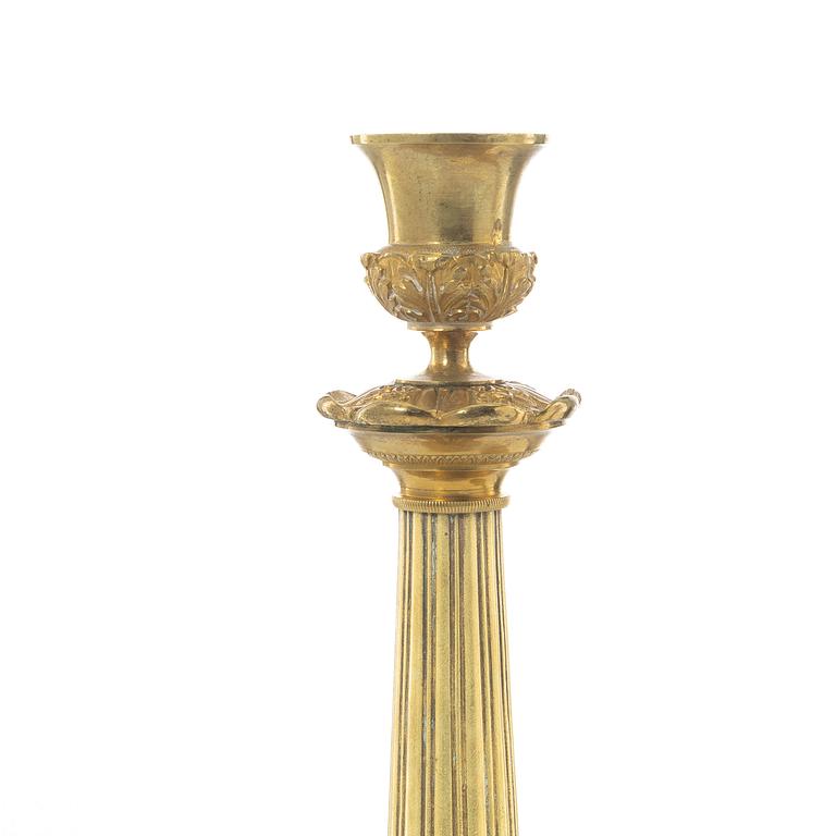 A pair of French Empire candlesticks, early 19th century.