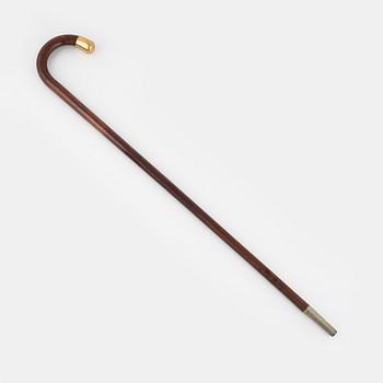 Walking stick, made of wood with upper part 18K gold.