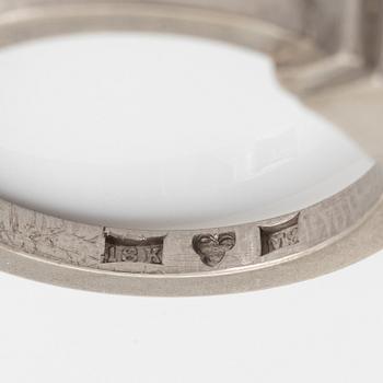 An 18K white gold Wiwen Nilsson ring set with a round brilliant-cut diamond.