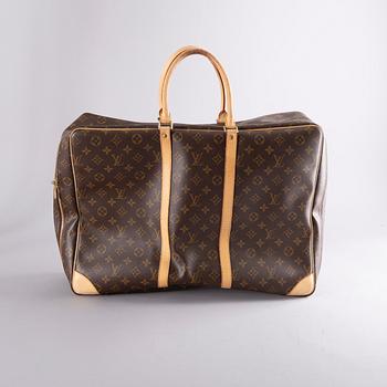 A Louis Vuitton travel bag.