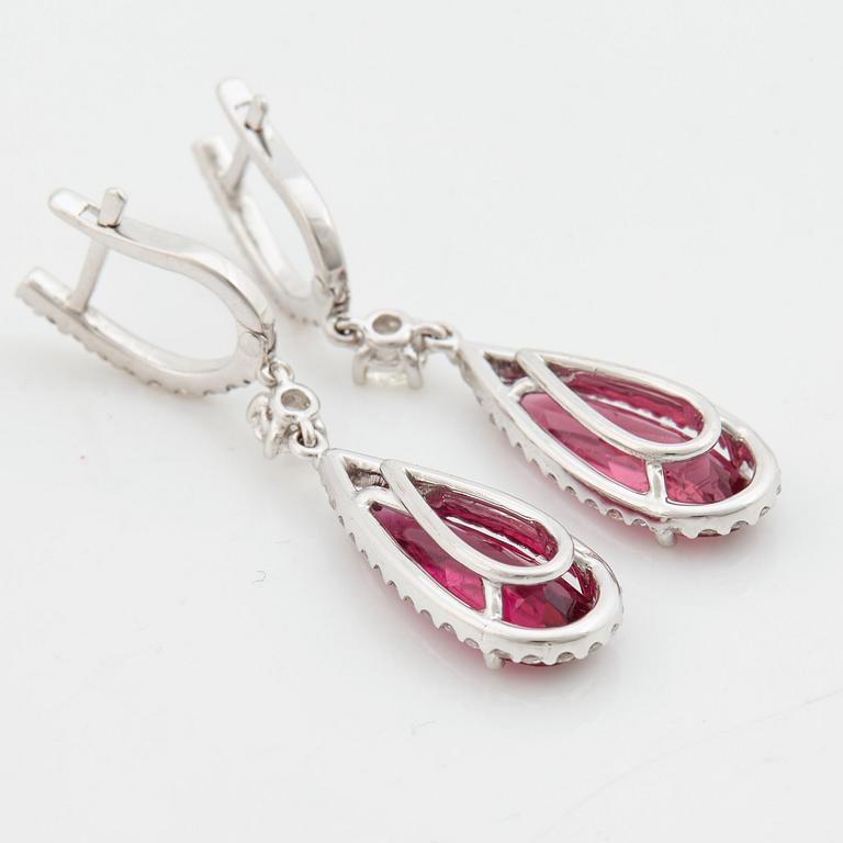 A pair of rubelite and brilliant cut diamond earrings.