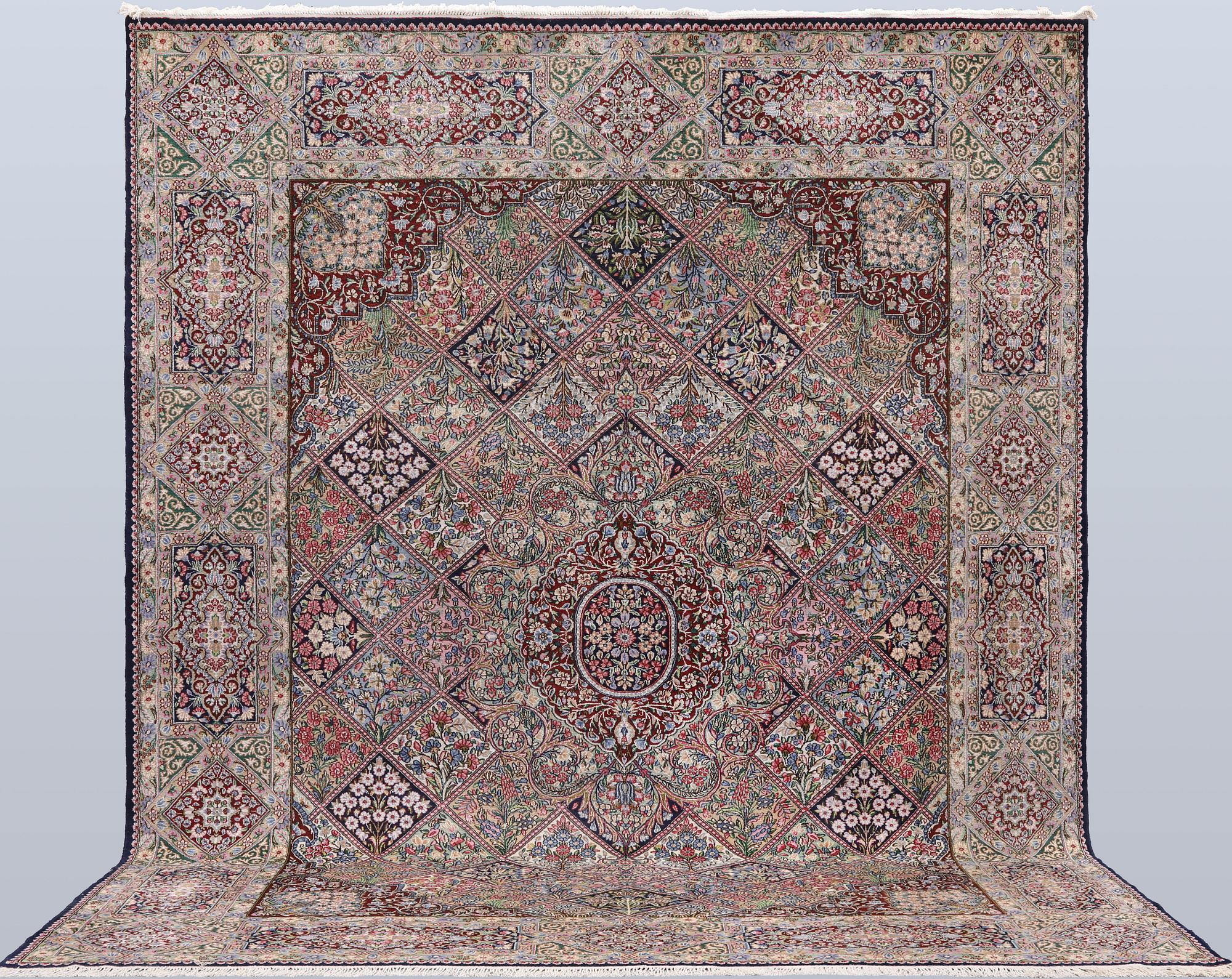 A Kirman lavash milifleur carpet, 400 x 310 cm.