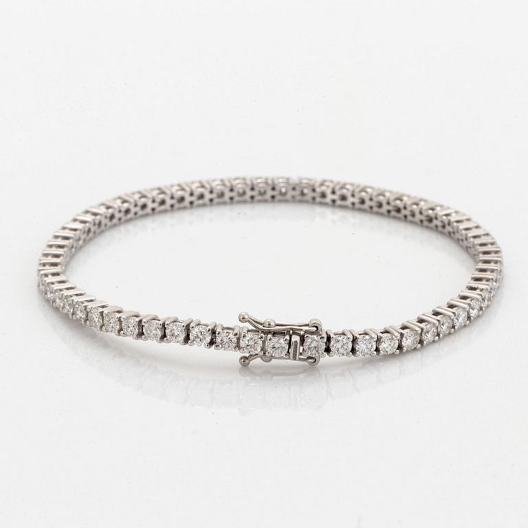 Brilliant-cut diamond tennis bracelet, with report HRD.