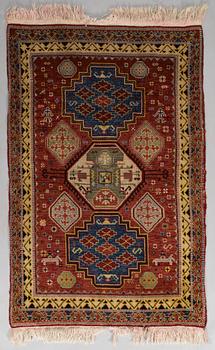 A 1940's Spanish rug Of Kazak design, ca. 139 x 93 cm.