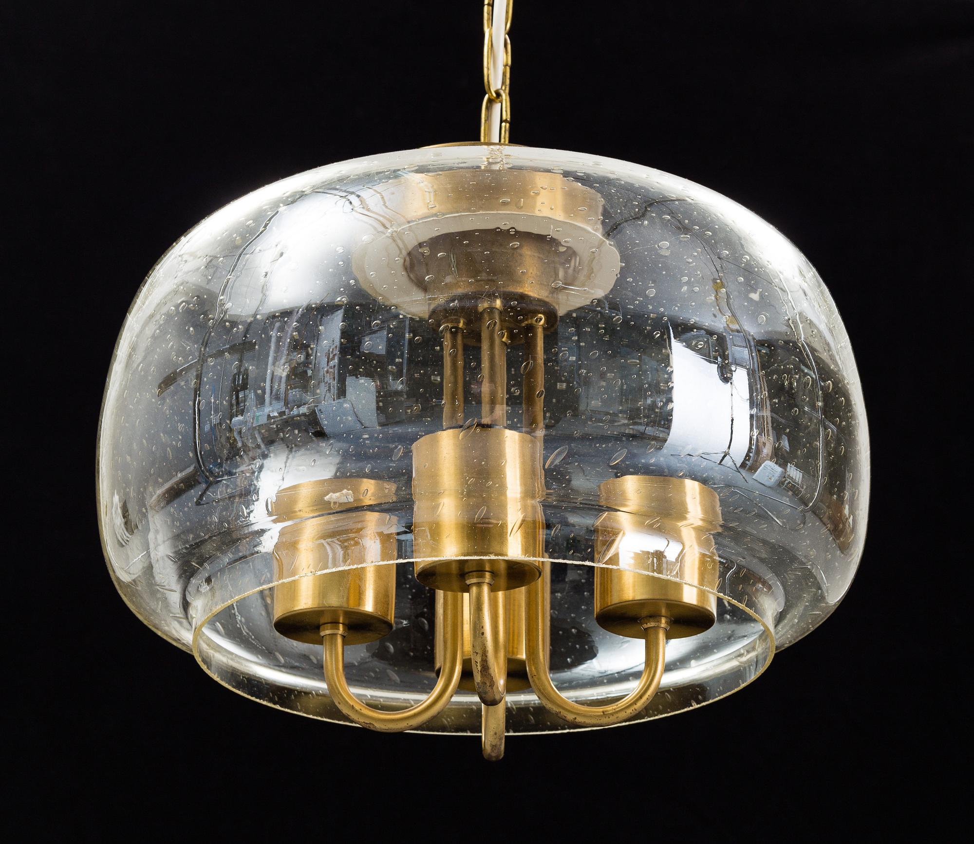 A 1960/70s glass and brass ceiling lamp.