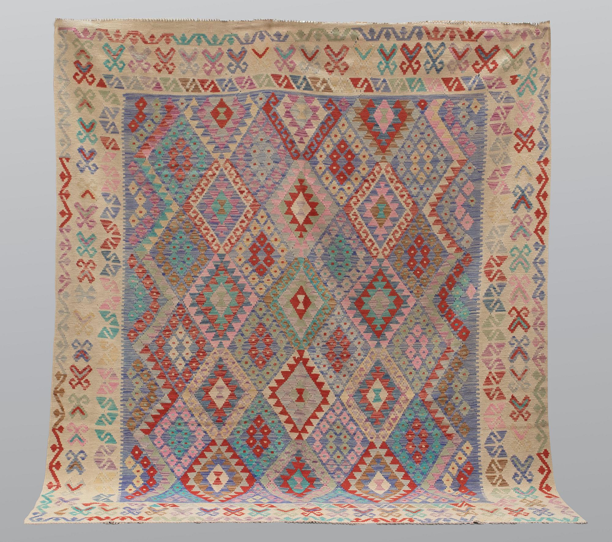 A carpet, kilim, ca 290 x 257 cm.