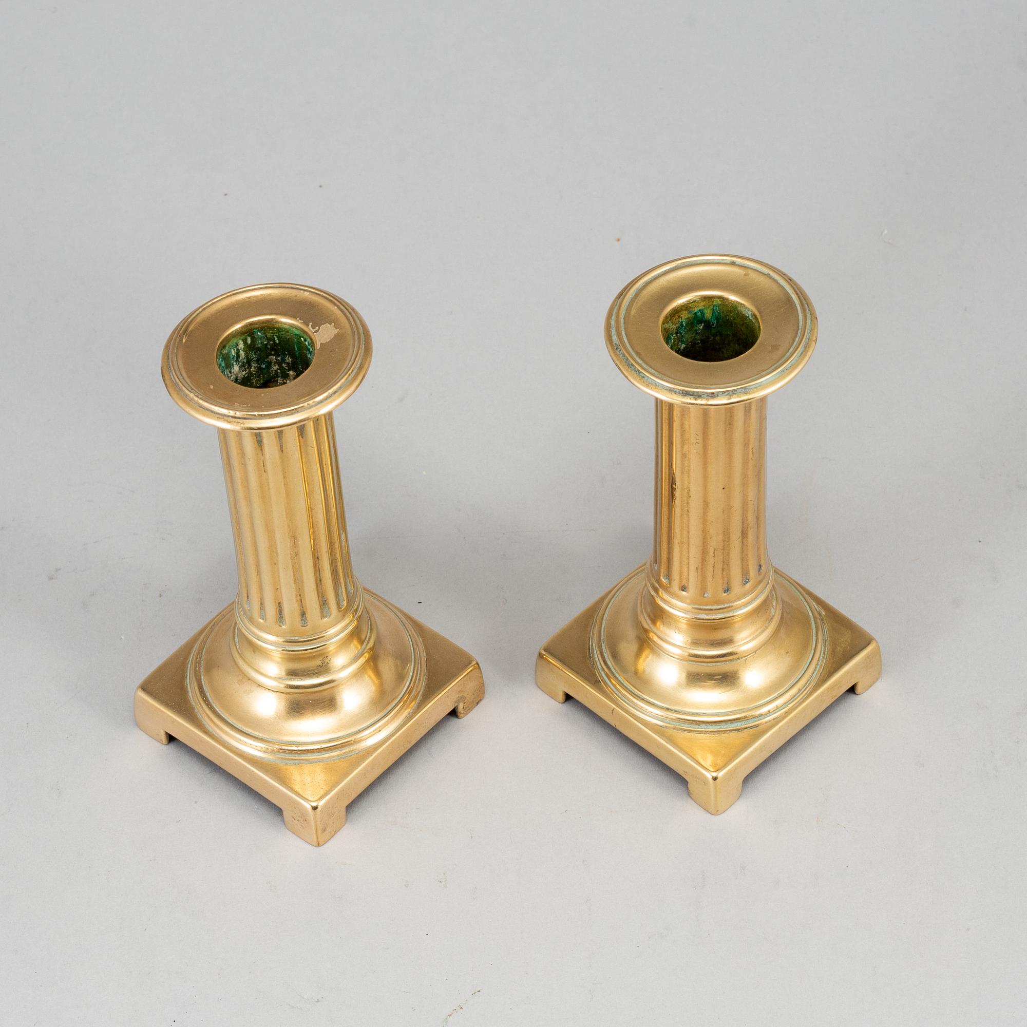 A pair of Louis Seize bronze candlesticks, late 18th century.