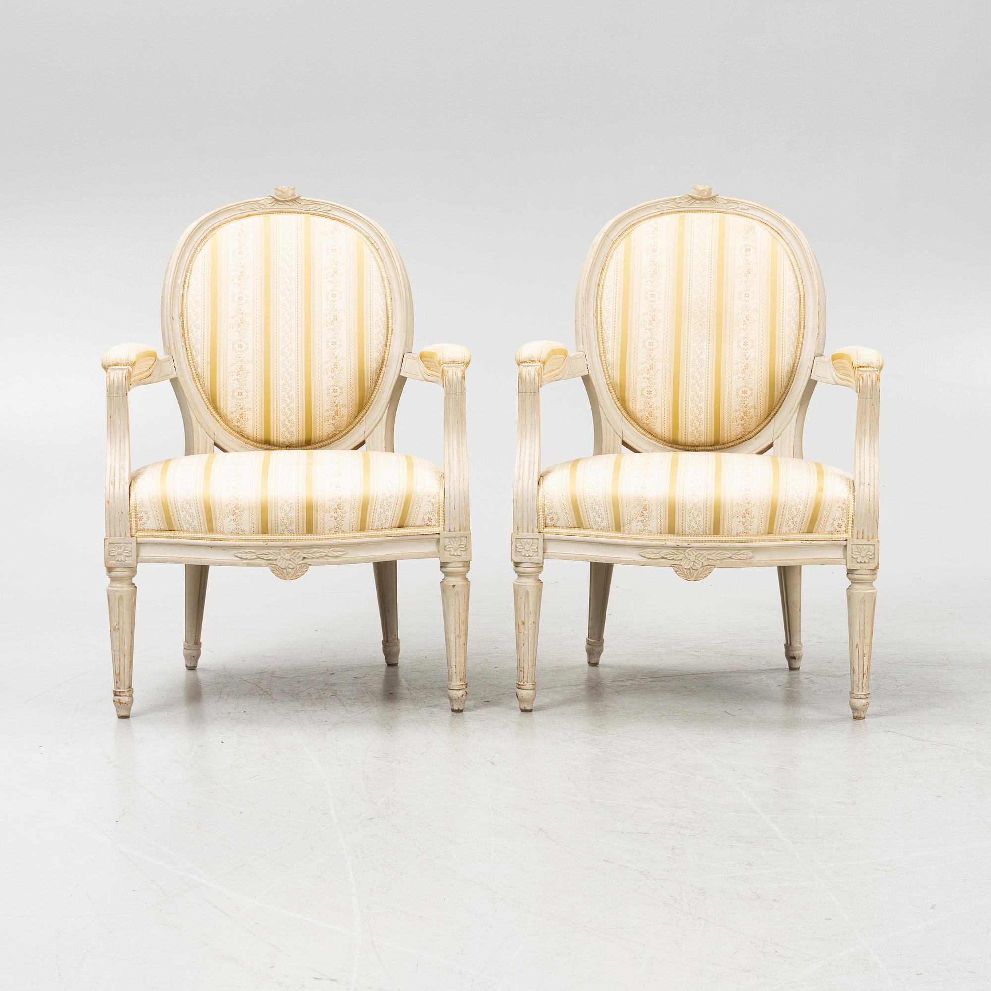 A pair of Gustavian style armchairs signed J.G.A, mid 20th century.
