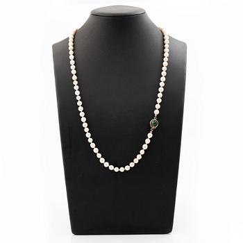 Cultured pearl necklace with Niels Erik From clasp, Denmark, silver set with a green cabochon-cut stone.