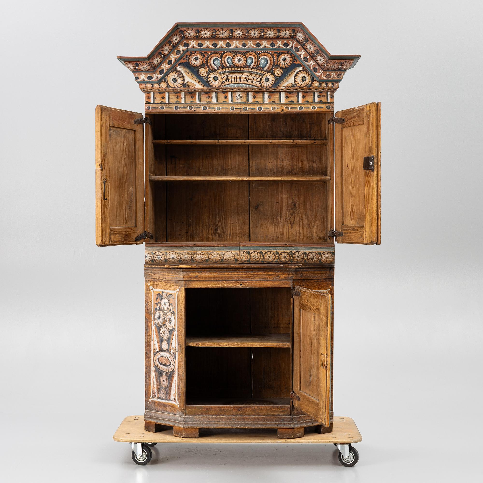A Swedish Dalecarlian folk art cabinet dated 1808.