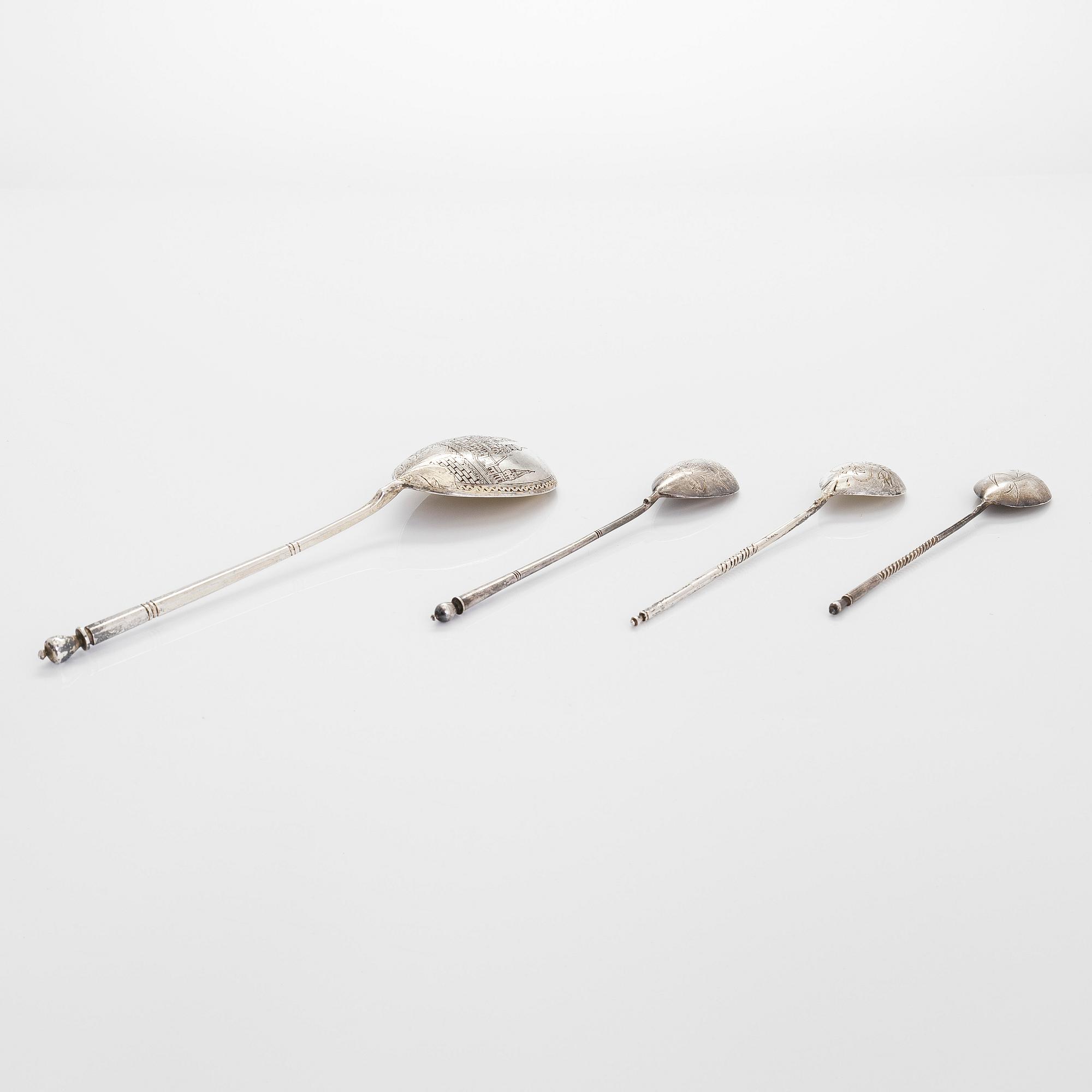 Three silver tea glass holders and four spoons, silver Kostroma and Moscow, late 19th and early 20th centuries.