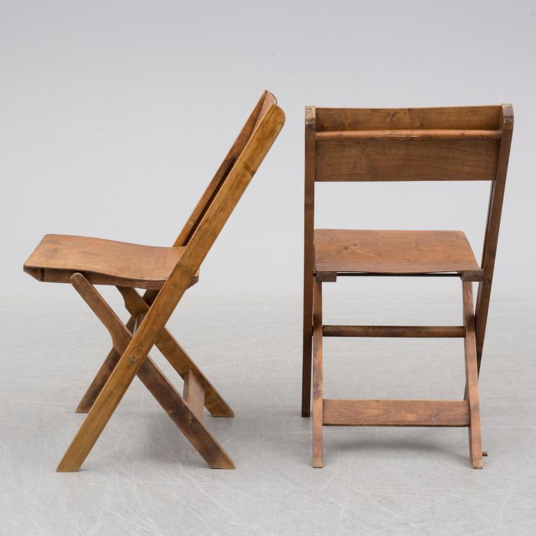 a set of 8 foldable chairs from the 1930's.