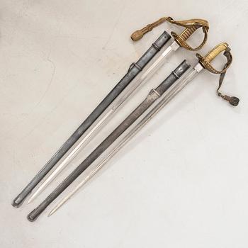 To Swedish sabres, 1893 cavalry pattern, with scabbards.