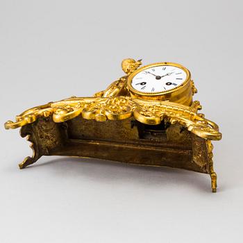 A LATE 19TH CENTURY GILT METAL MANTLE CLOCK in the Rococo style.