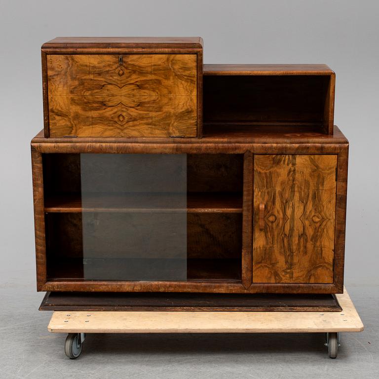 A walnut veneered cabinet, 1930's.