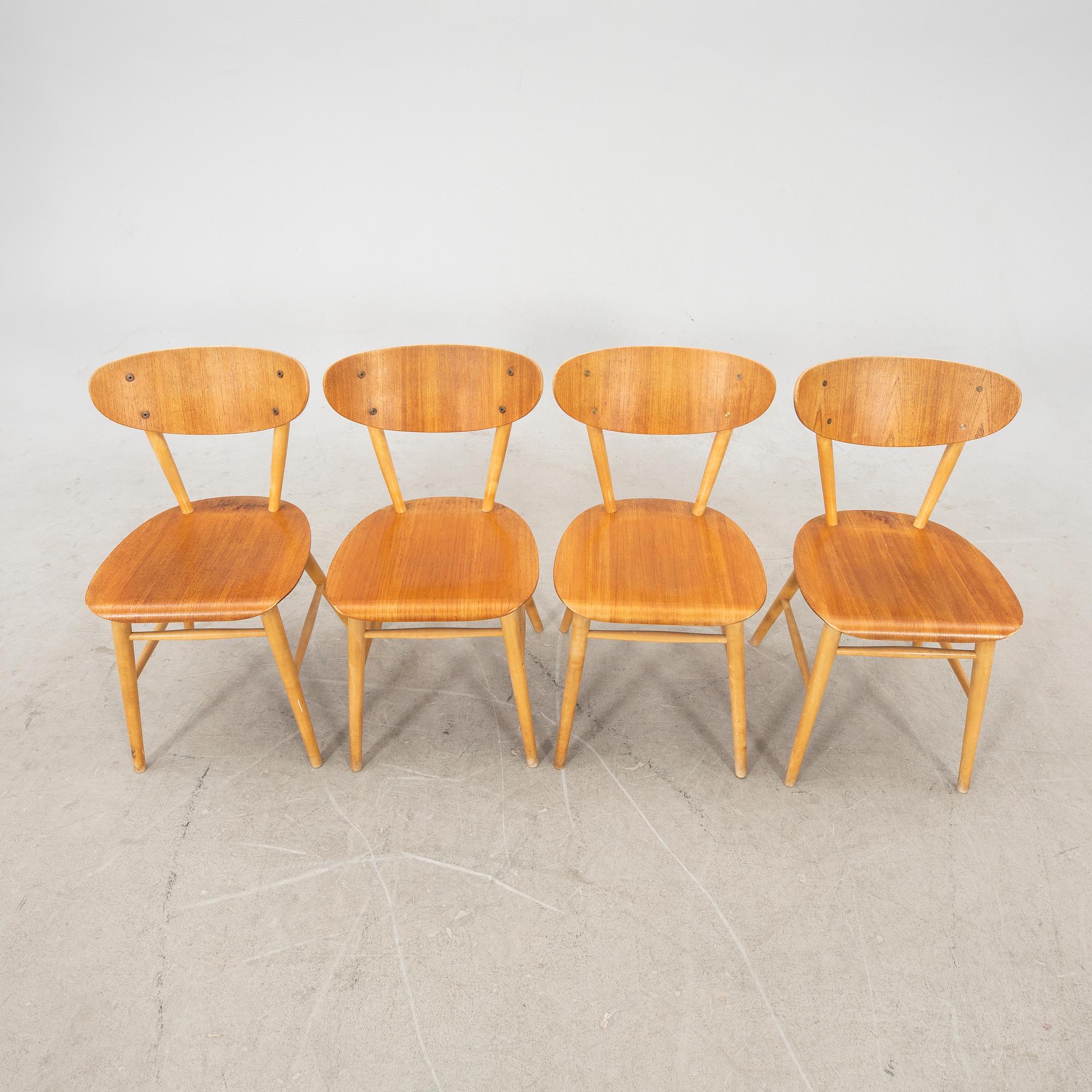 A set of four birch and teak veneered chairs from Bröderna Wigells stolfabrik, Malmbäck mid 20th century.