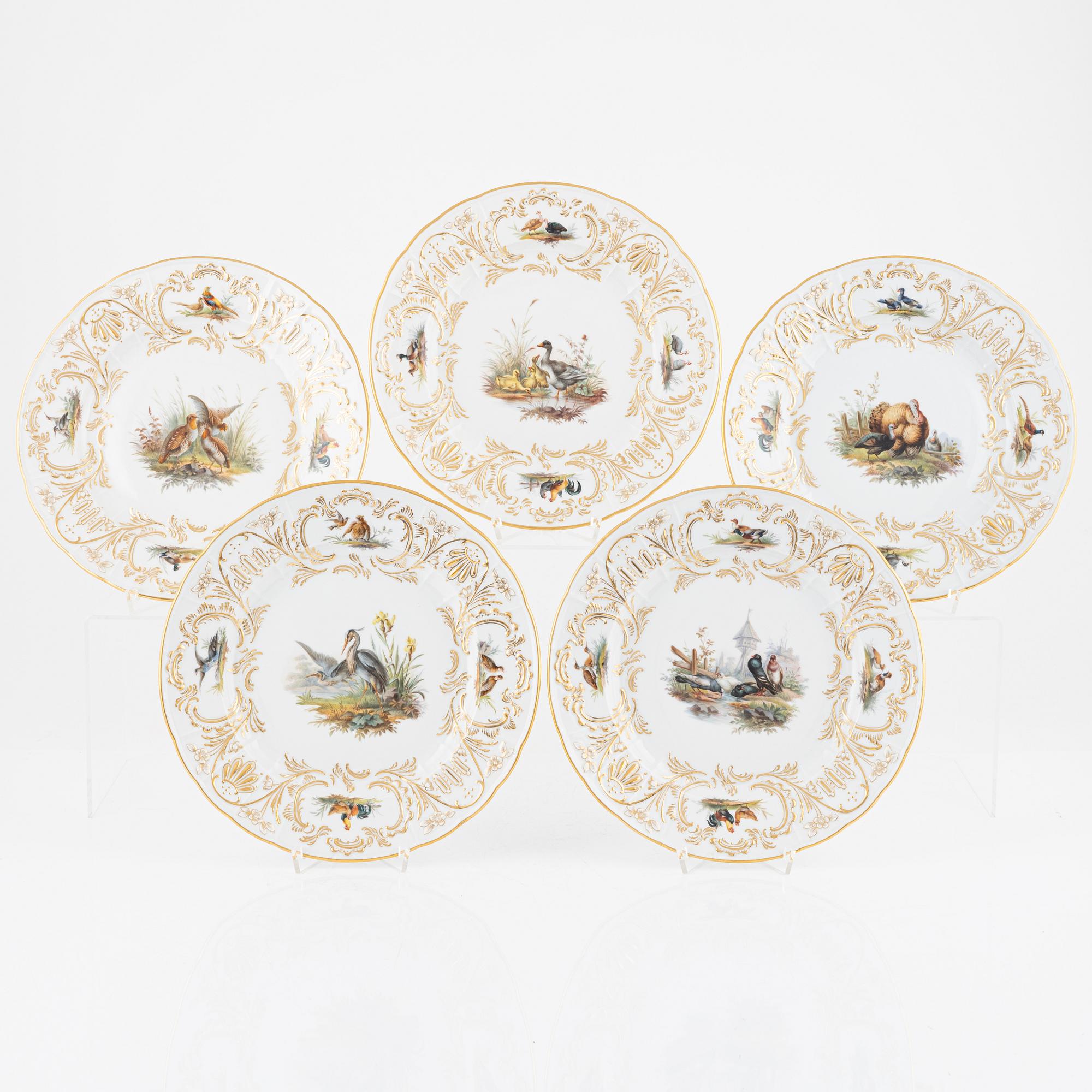 A set of five Meissen porcelain games plates, late 19th to early 20th century.