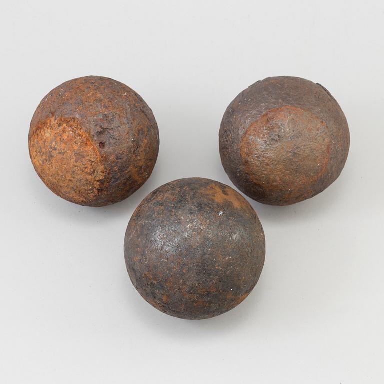 a set of three iron canon balls, 18th-/19th century.