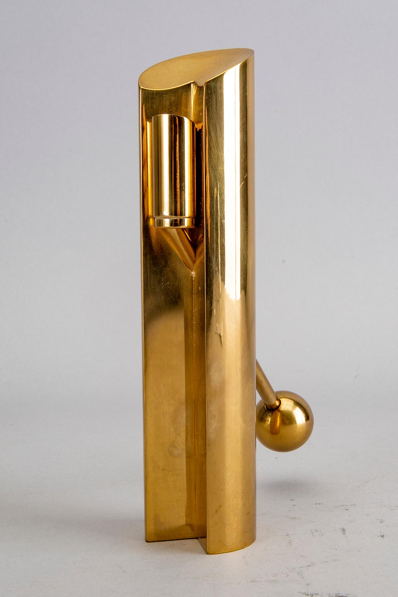 A Pierre Forssell brass candle stick for Skultuna.