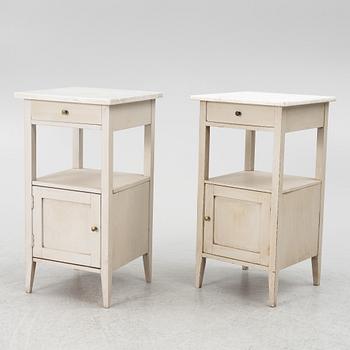 A matched pair of bedside tables.