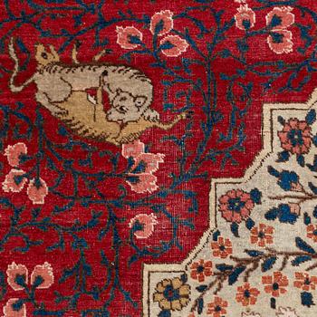An antique Tabriz carpet, ca 333 x 223 cm.