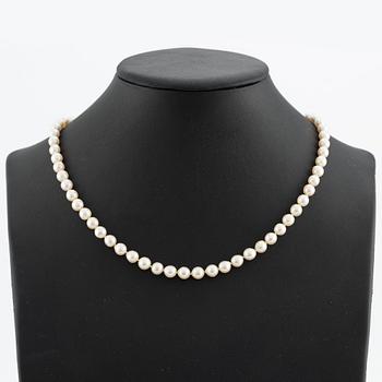 Necklace & bracelet, cultured pearls with 18K gold clasp and small diamonds.