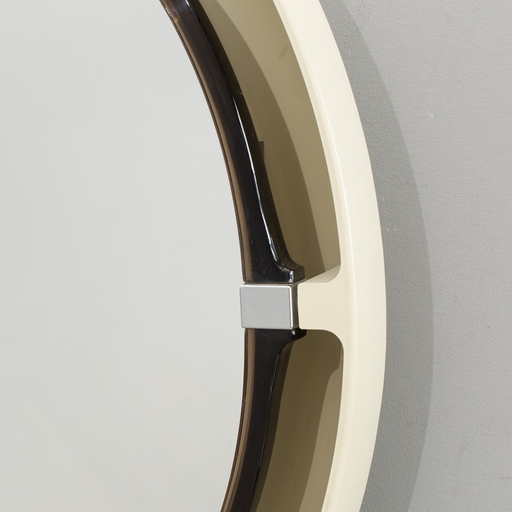 A "SPACE AGE" WALL MIRROR WITH LIGHT BY ALLIBERT, 1970´s.