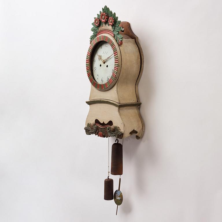 a painted wall pendulum clock from Ångermanland in the first half of the 19th century.