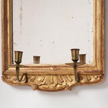 A pair of rococo giltwood two-branch girandoles, Stockholm, later part 18th century.