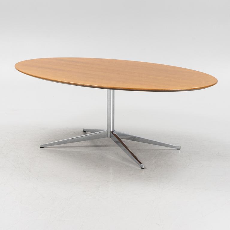 An 'Oval 96' table by Florence Knoll for Knoll International.