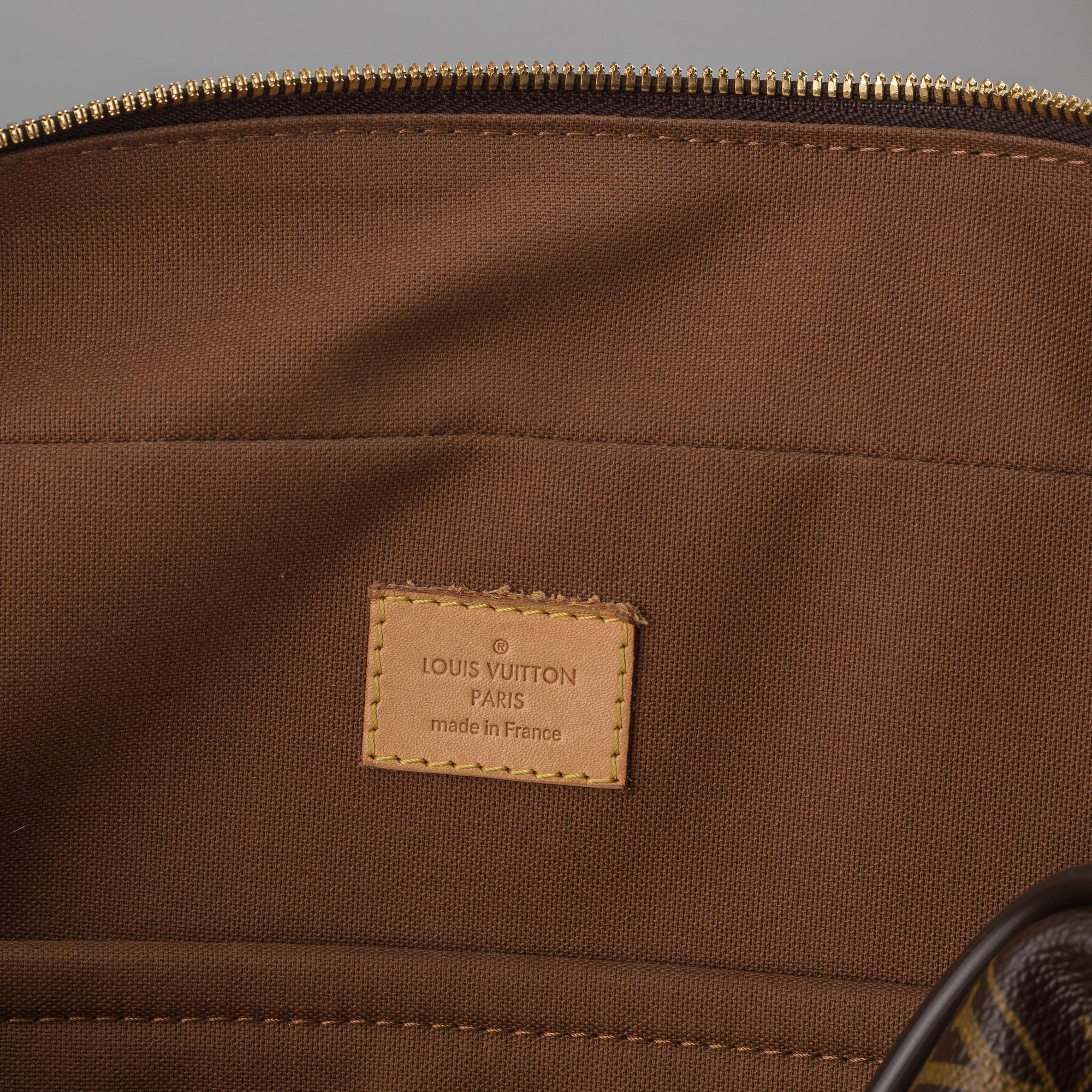 Louis Vuitton, a monogram canvas carry on bag.